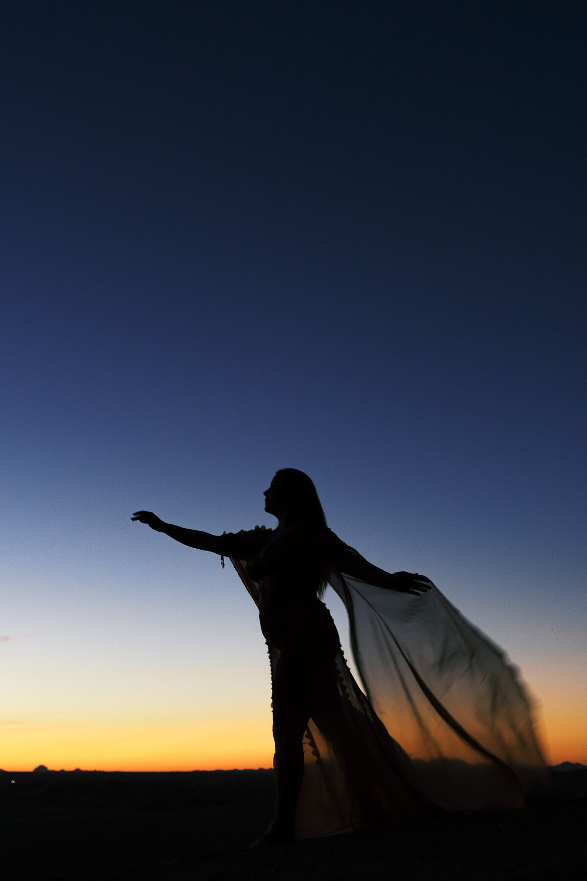 woman-flowy-dress-sand-dunes-sunrise
