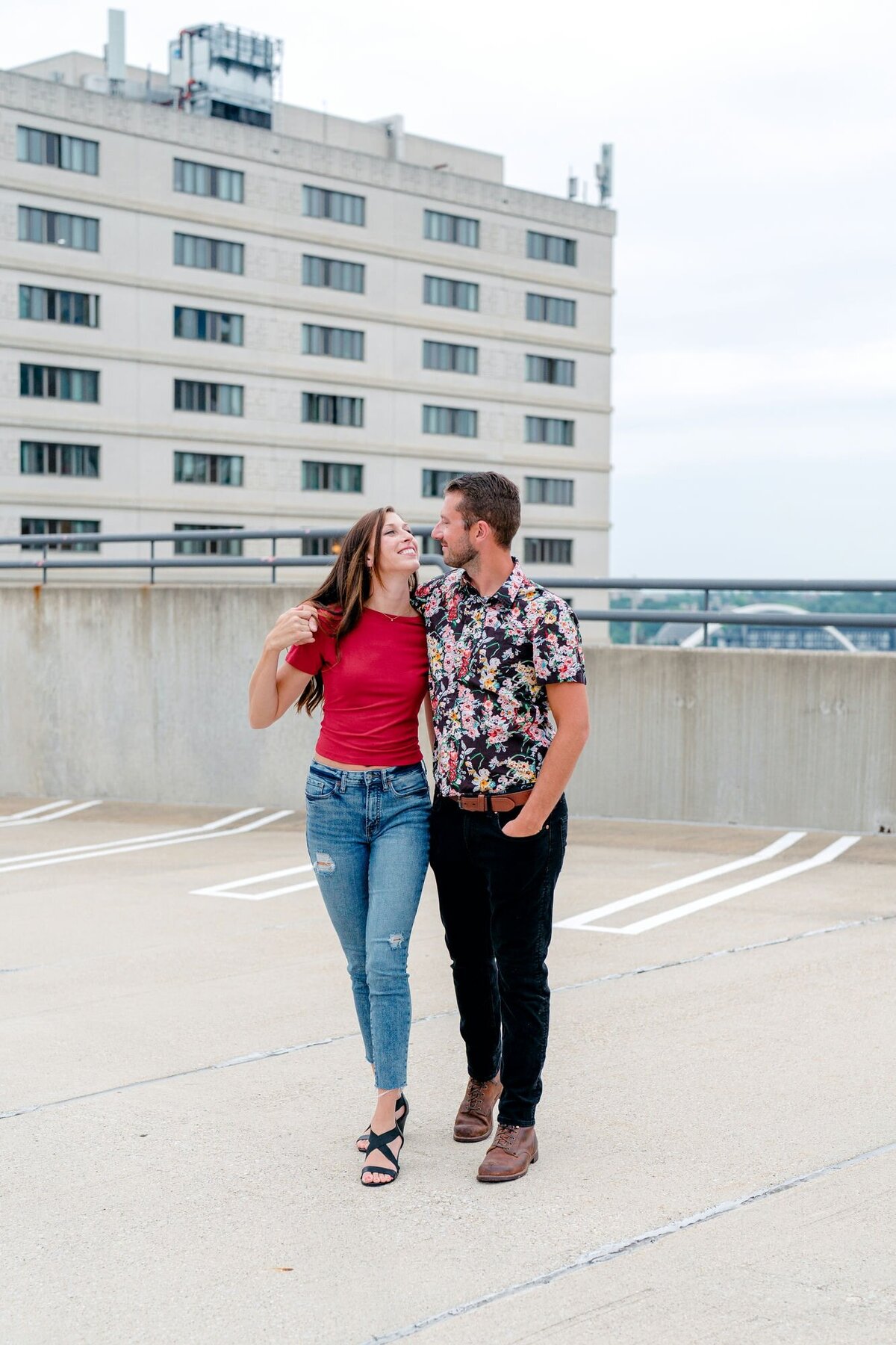 couple-walking-hugging-rooftop-engagement