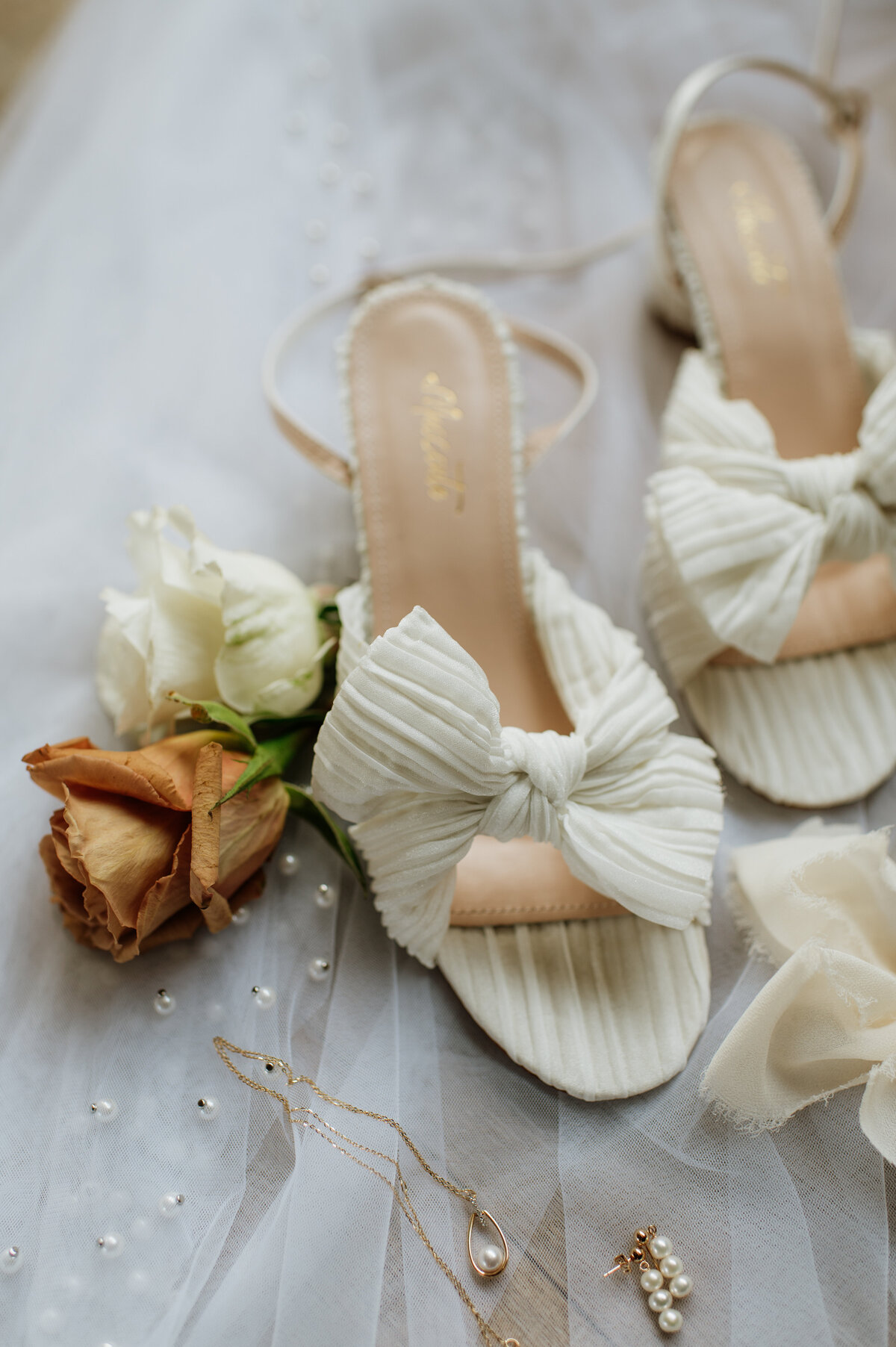 Wedding shoes and flowers flat lay South Bend