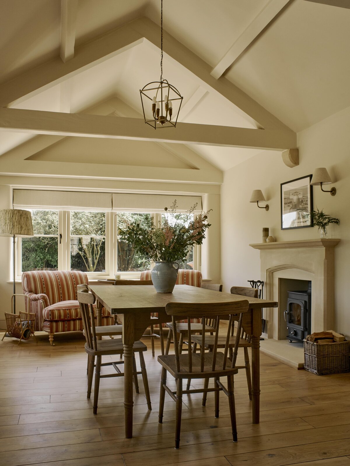 Bespoke dining table with flower arrangement and custom sofa