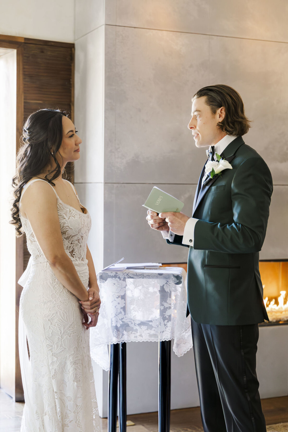 Bride and groom have a micro wedding ceremony in the Lounge at The Roundhouse