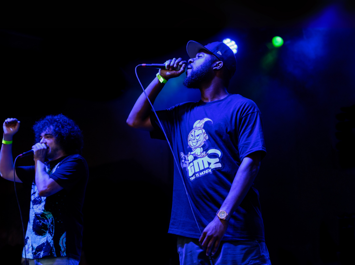 Two rappers onstage in New Hampshire performing a concert