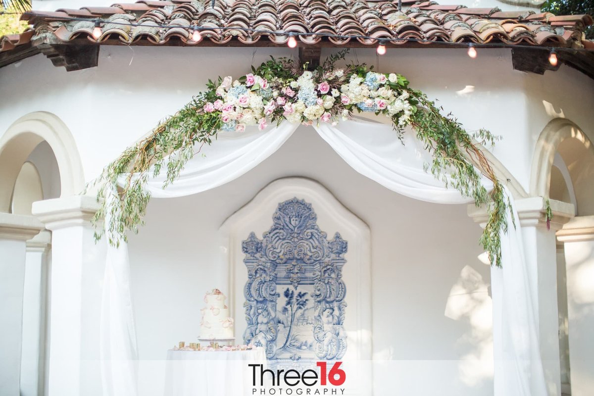 Wedding Altar with white 3-tiered wedding cake on display