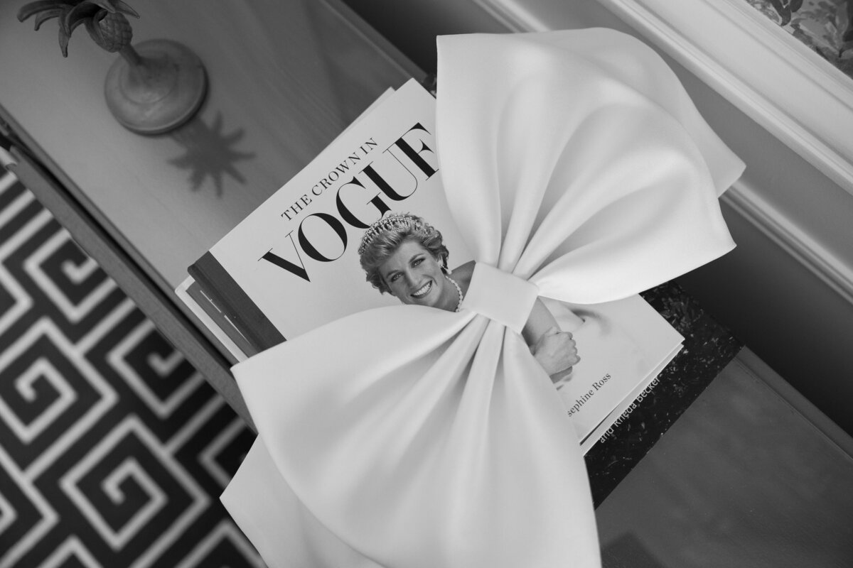 A close-up of the elegant bow detail on the bridal dress at The Madison Club, showcasing the exquisite craftsmanship and style that complements the wedding's sophisticated ambiance.