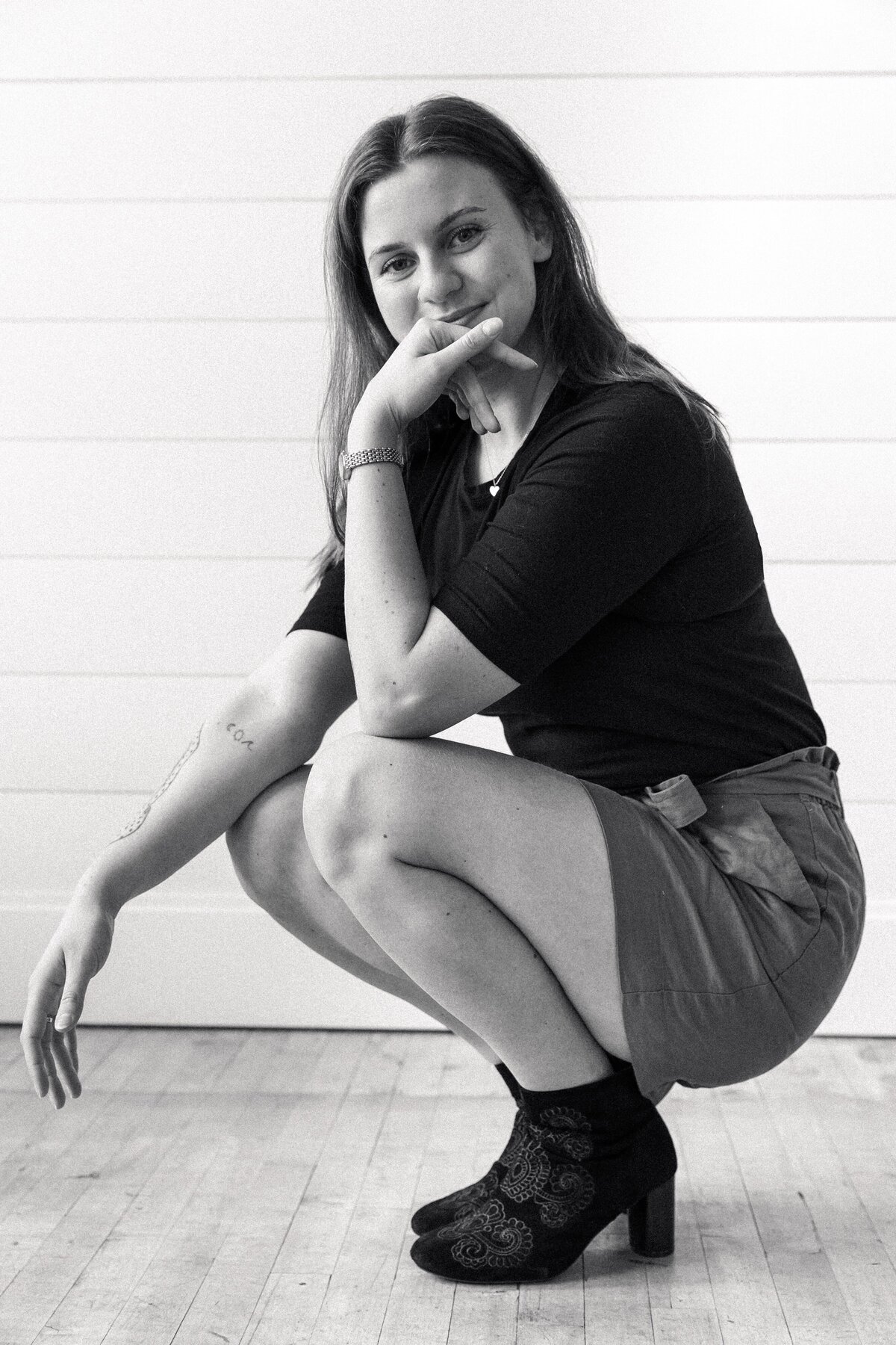 Owner of a website design company smiling at the camera.