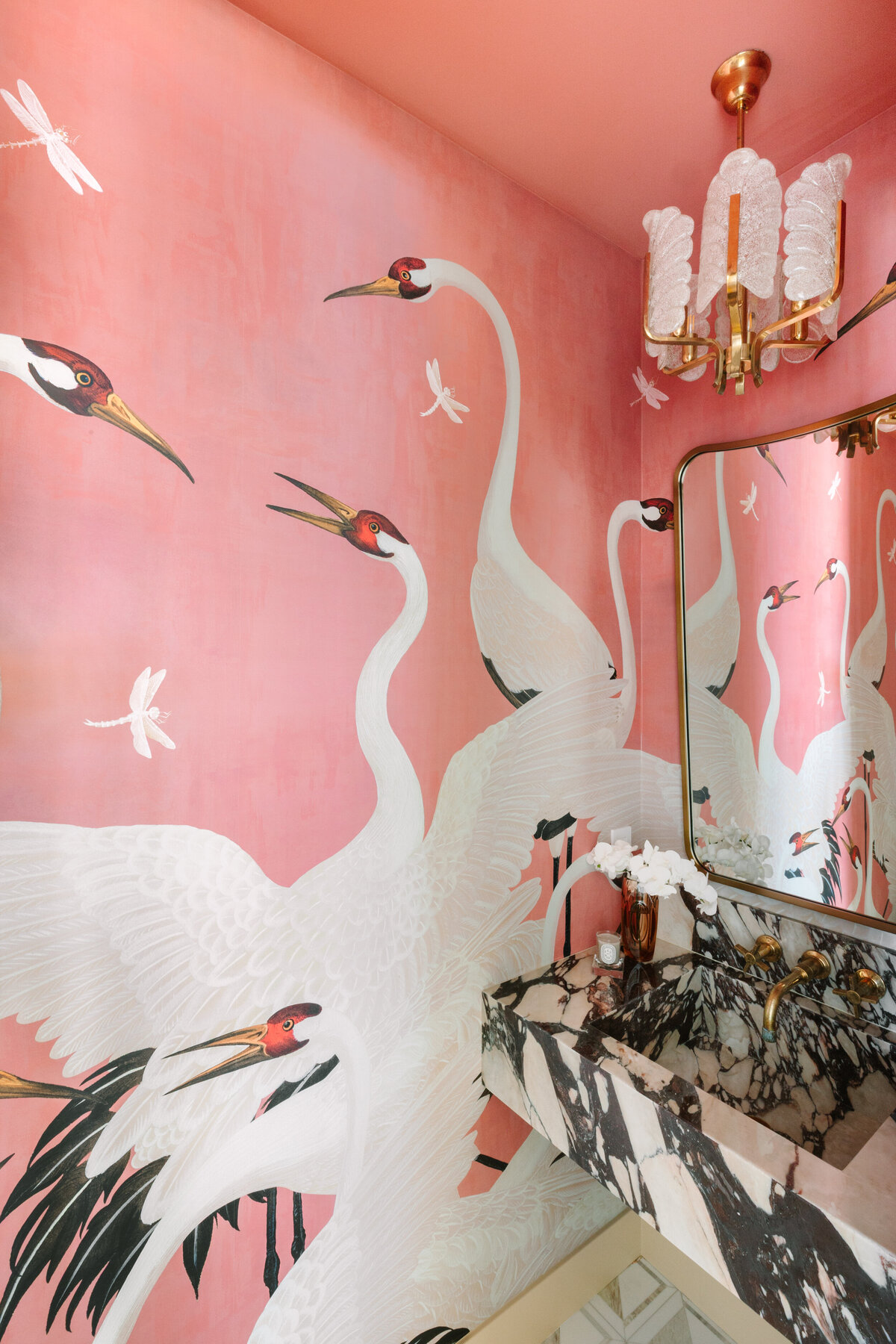 3'x5' powder room with Calacatta Vagli vanity and sink, Gucci Heron wallpaper, Italian shield mirror, and vintage Carl Fagerlund for Orrefors 1960's pendant.