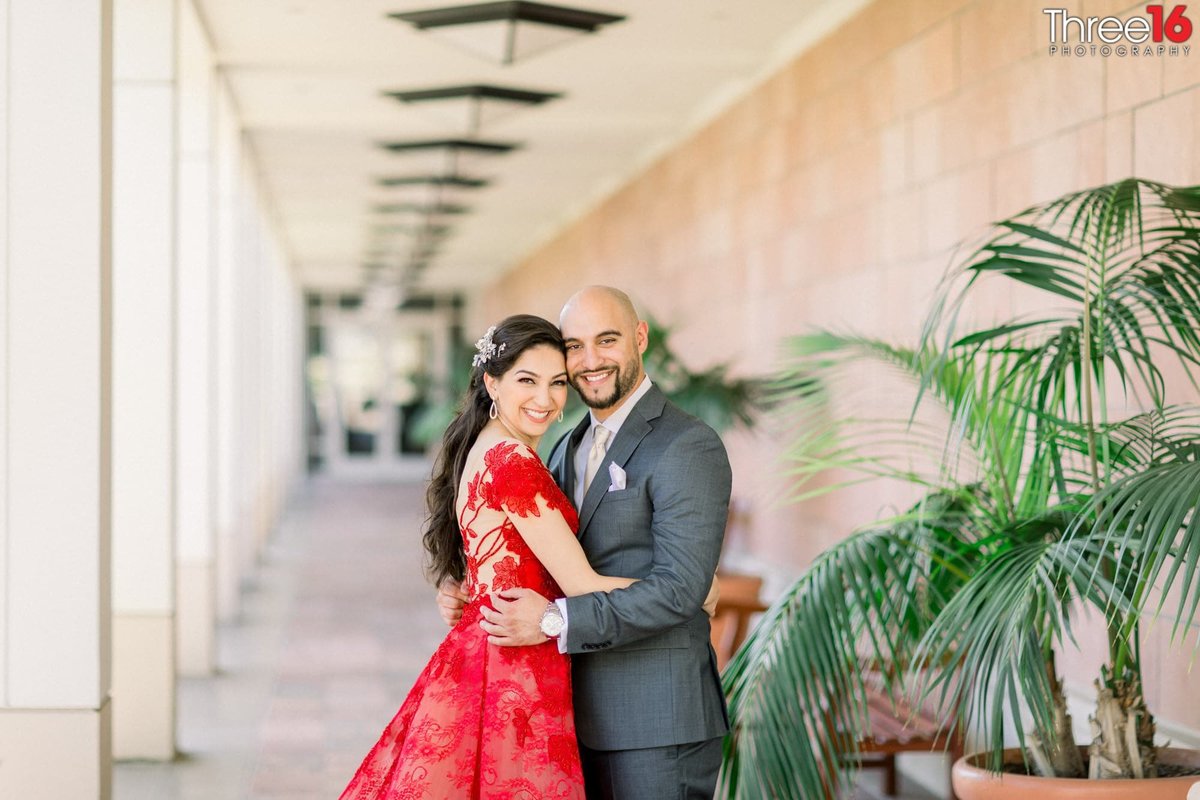 Newly married couple embrace during the photo shoot