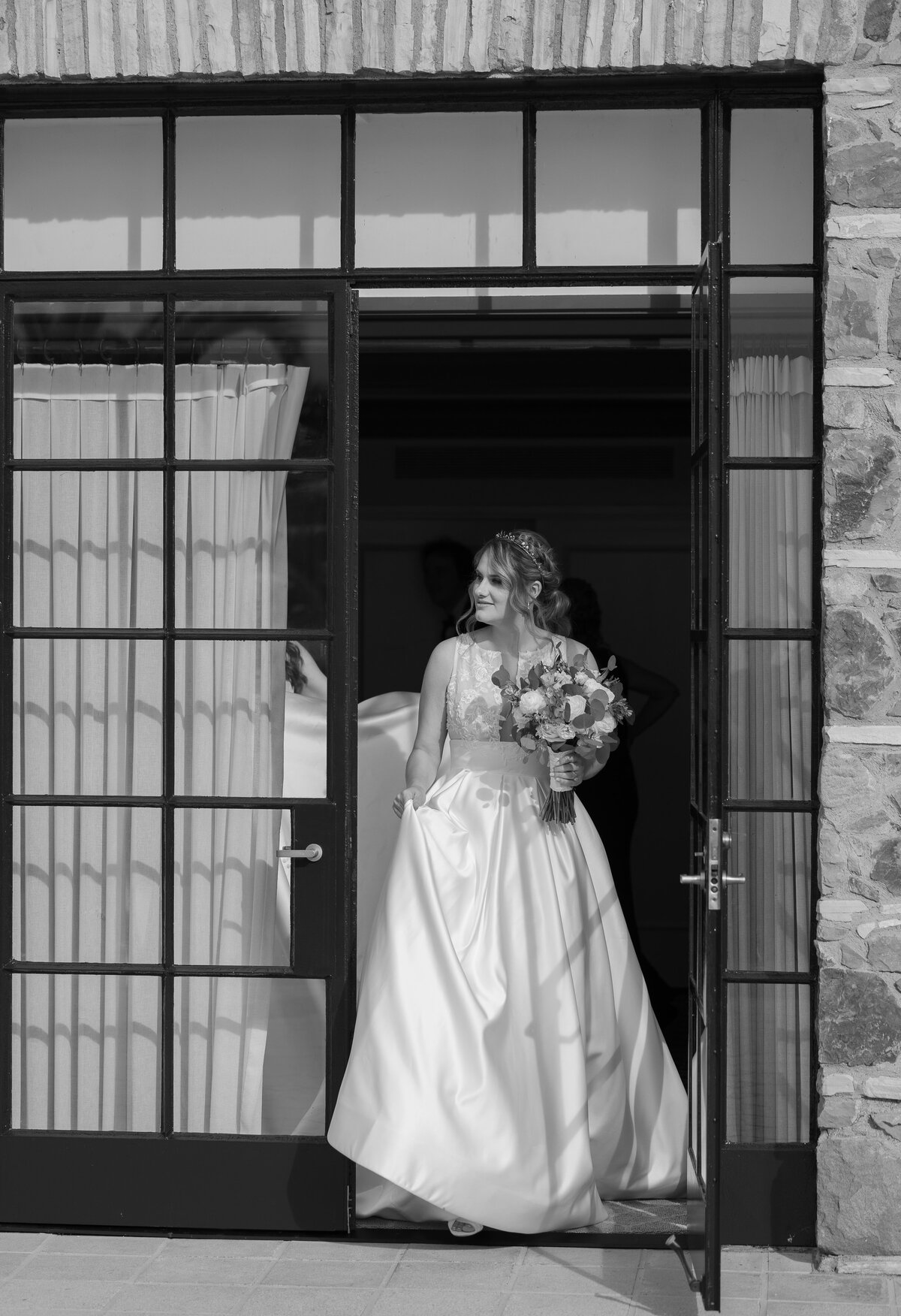 Bride wearing a wedding dress holding a bouquet of flowers