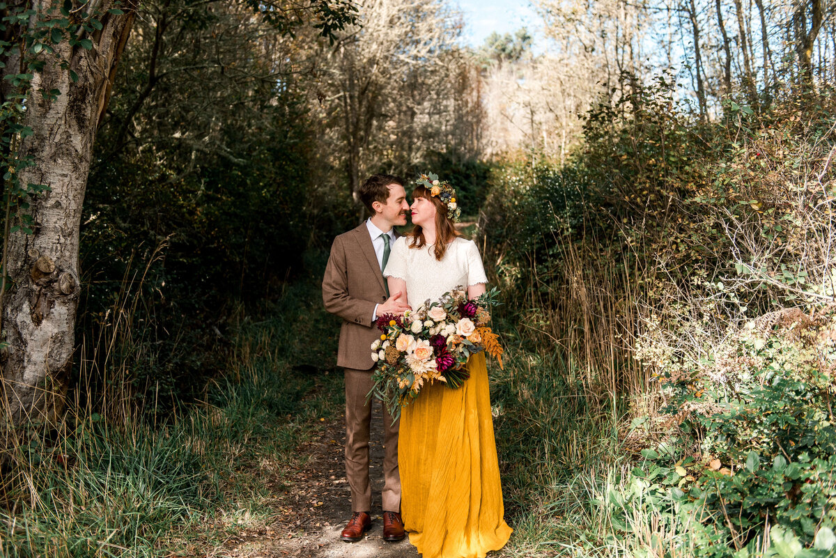 Bride and groom in the forest at their vashon island wedding