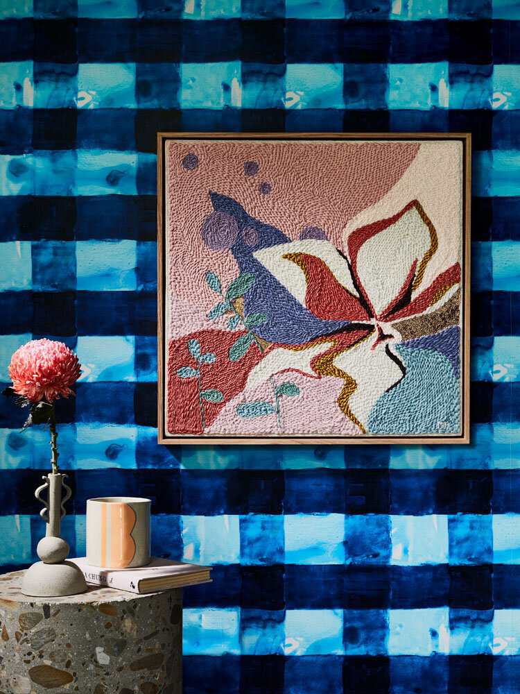 Vibrant blue feature wall with textured floral artwork, styled by Melbourne-based interior stylist Lisa Hunter Interiors.