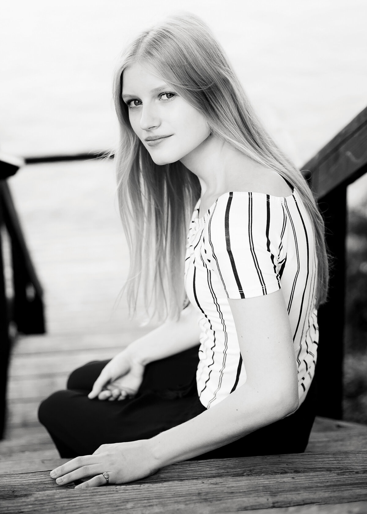 Striking senior photo taken on stairs by Keuka Lake