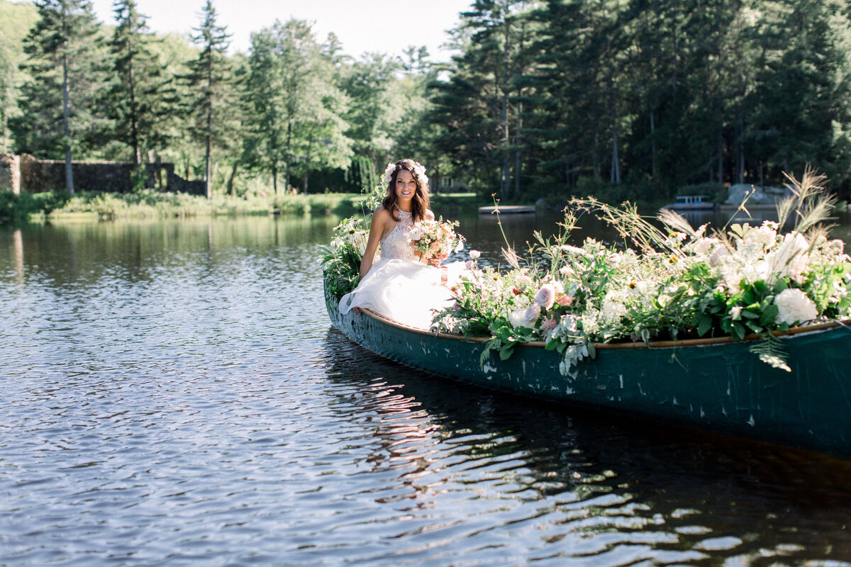Bride in Canoe with Flowers