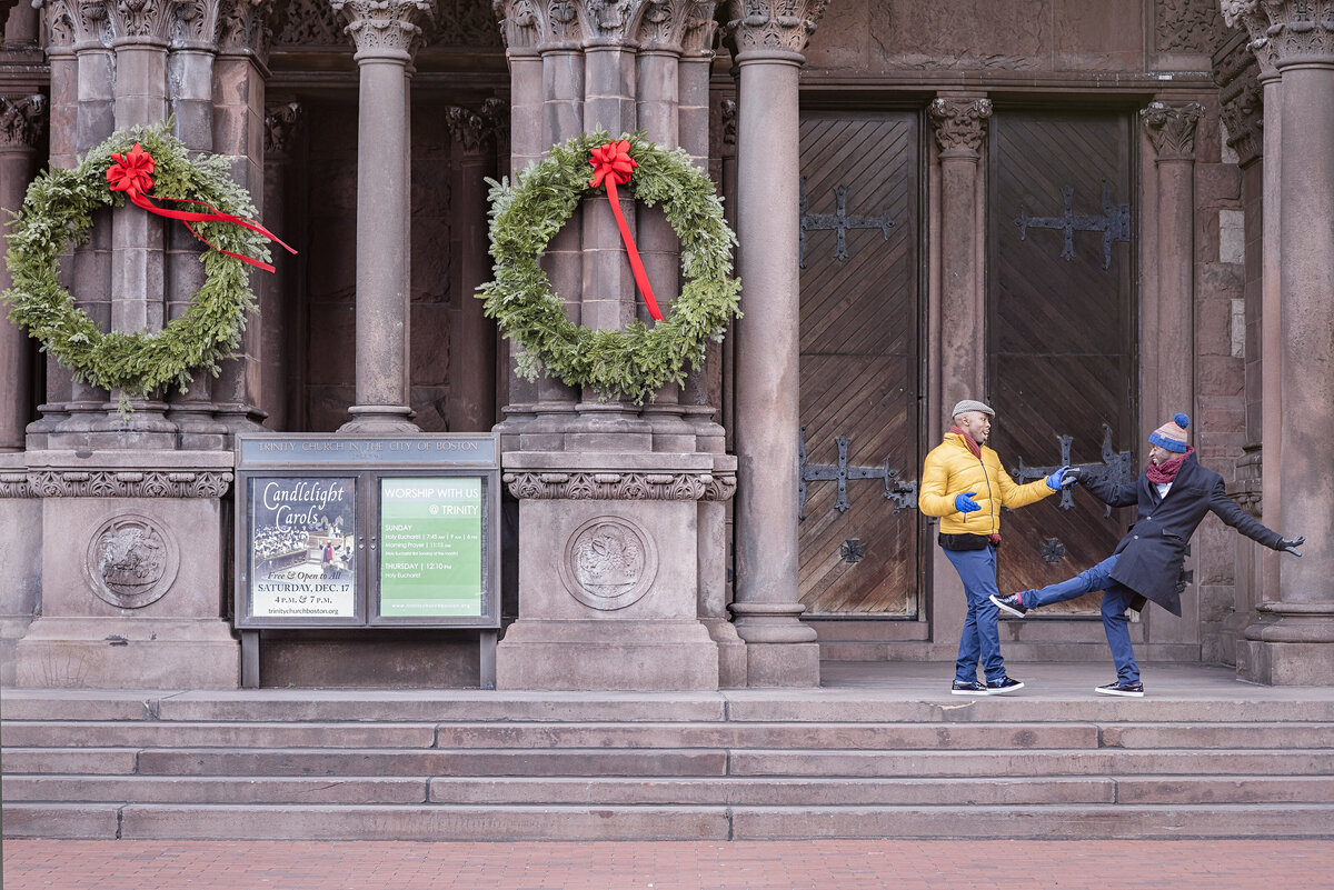 A couple dancing on a building's staircase
