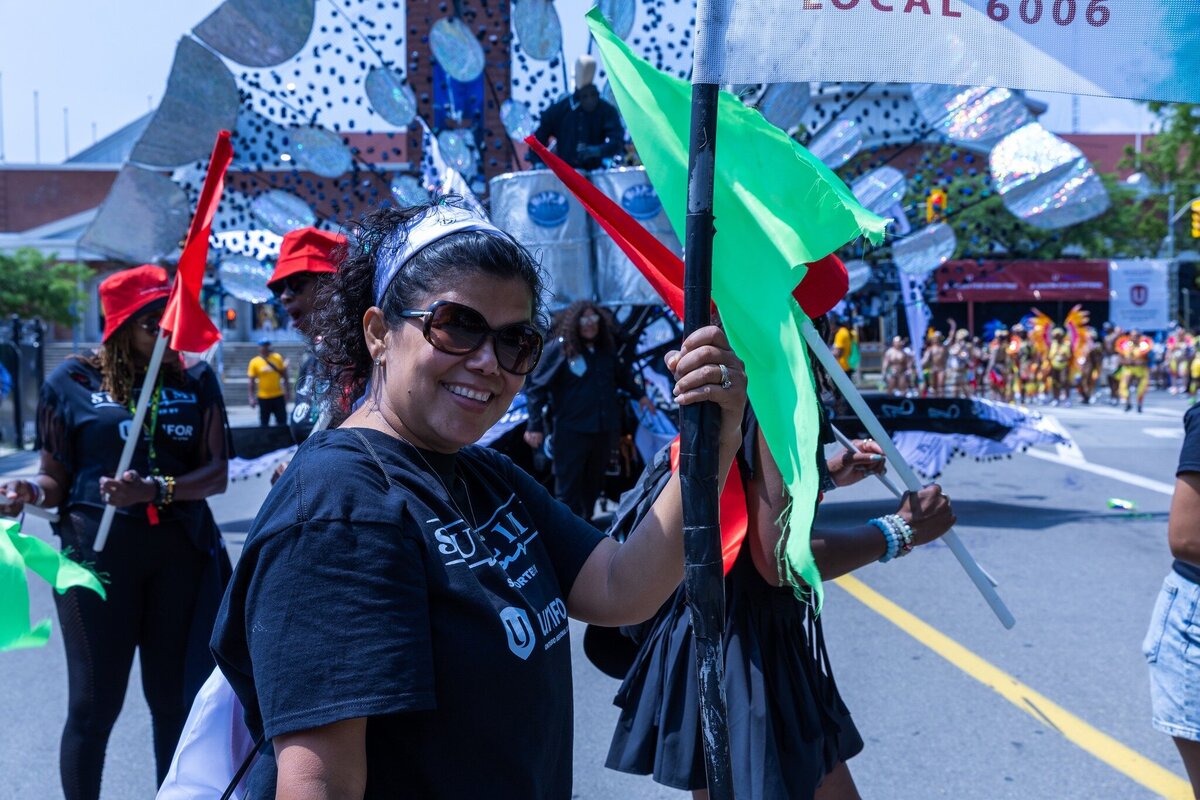 Toronto caribbean carnival parade masqueraders having fun in costume with Sunlime Mas, the number 1 medium size band at Toronto Carnival.