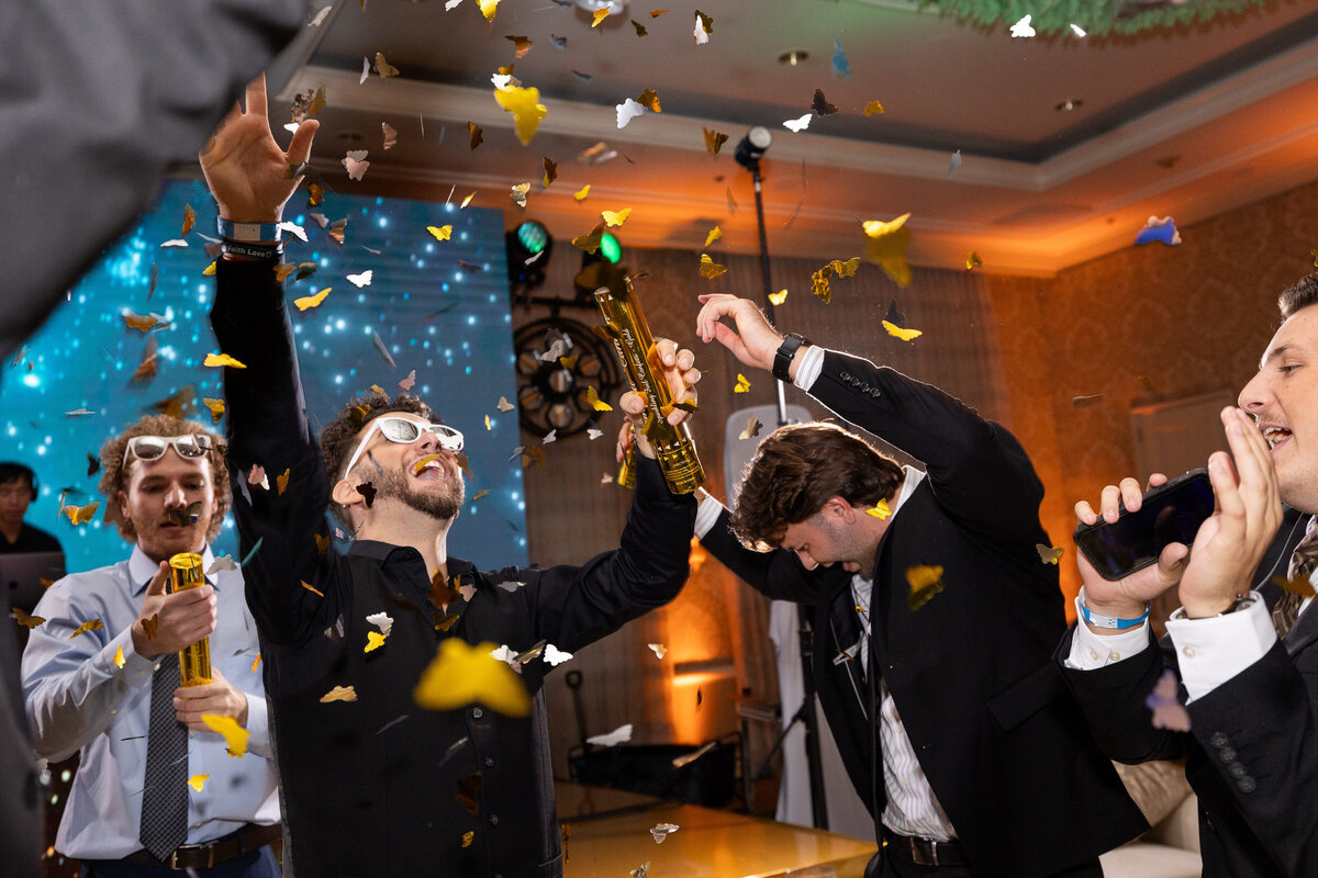 Male wearing white glasses on the dance floor