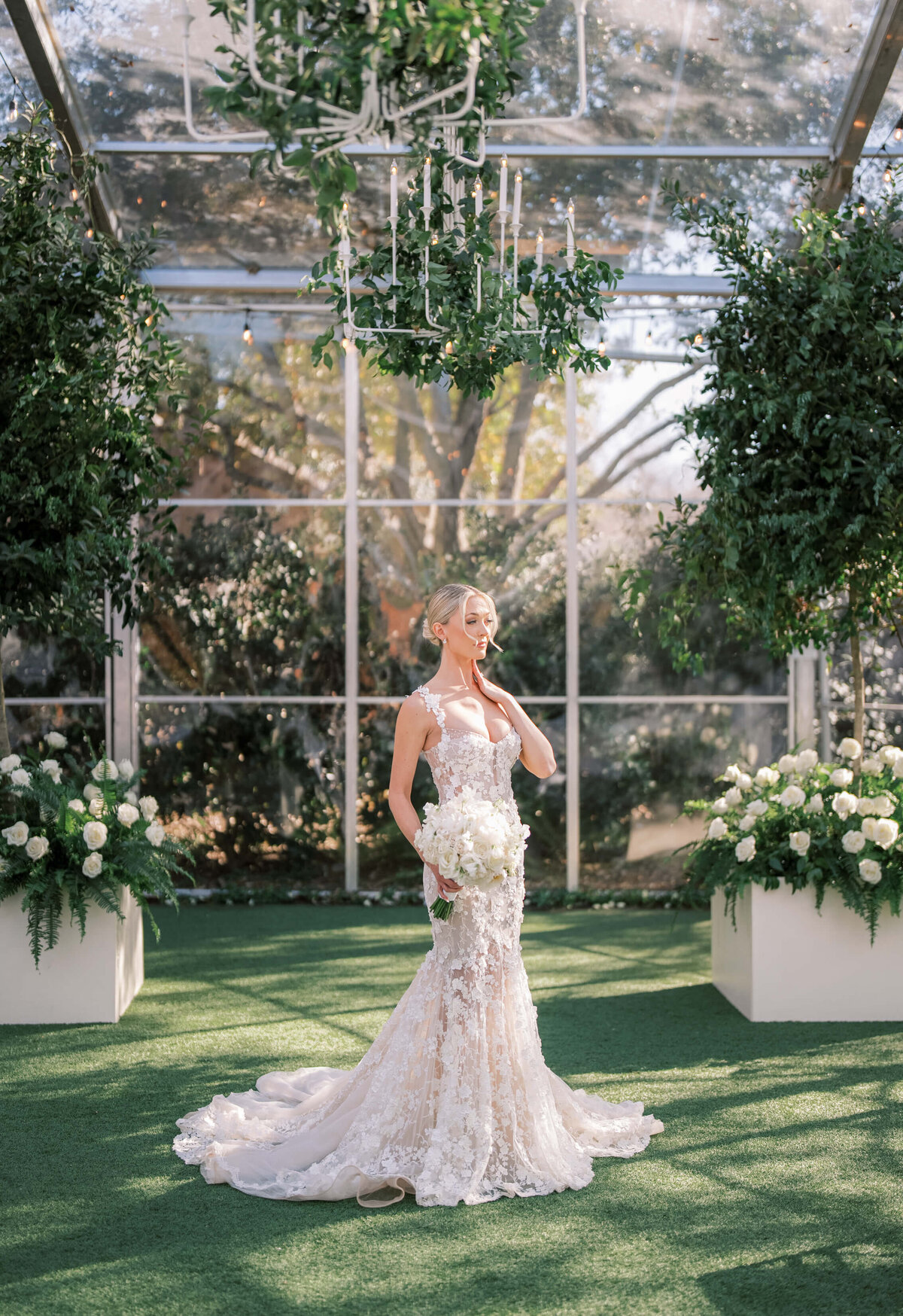 Bridal portraits at Hotel Drover, with the bride in a lace Galia Lahav gown holding a white bouquet