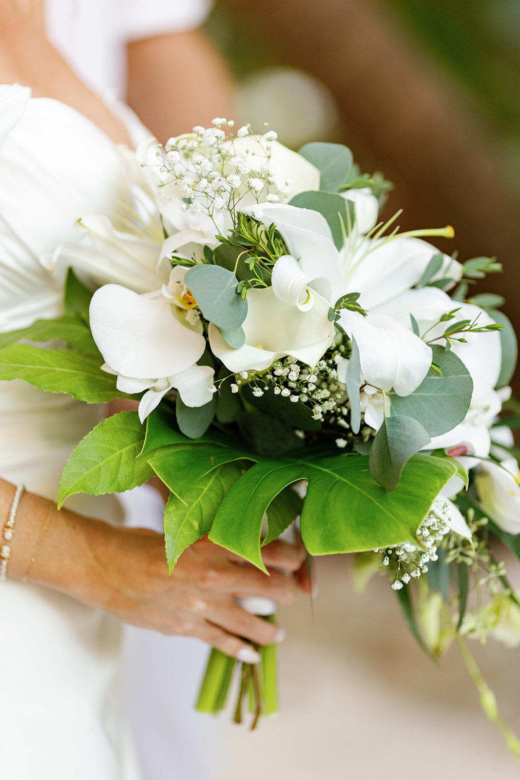 A stunning white and green floral bouquet held by the bride, perfect for a romantic Islamorada wedding at Casitas at Cheeca.