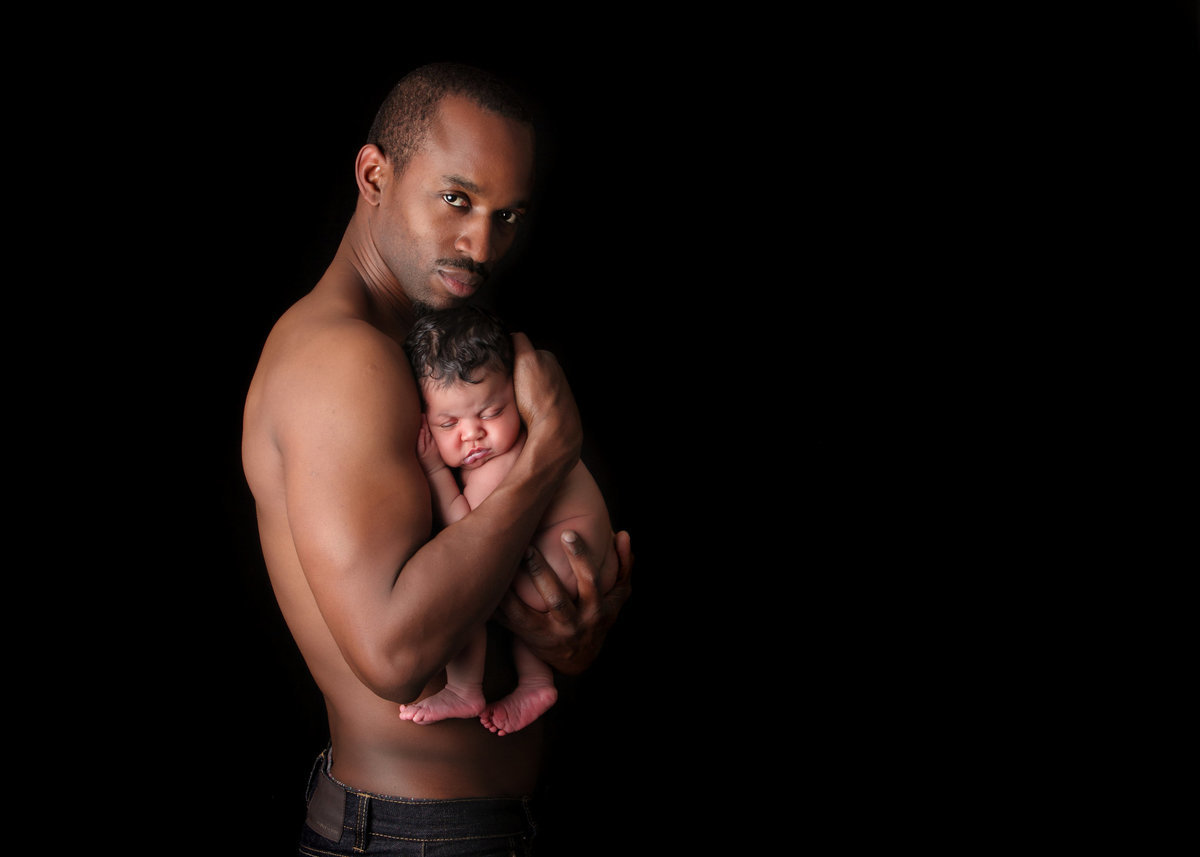 durham_region_newborn_photography_dad_holding_newborn_daughter