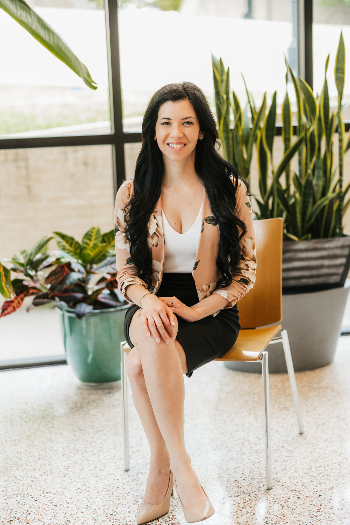 woman-sits-with-plants