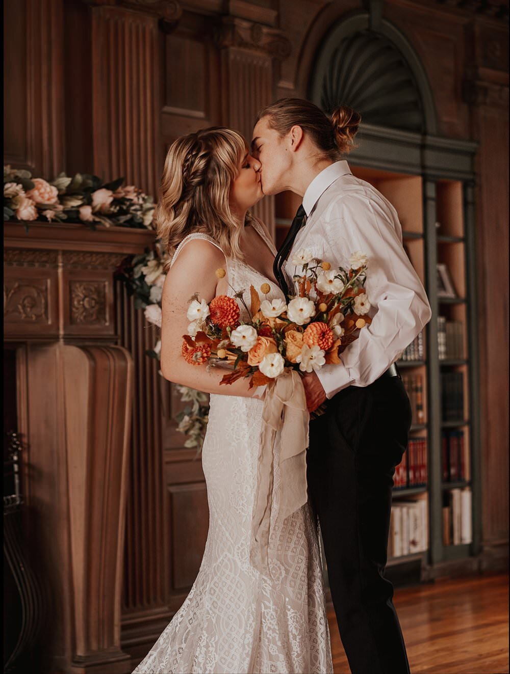 Couple kissing in the study of Austin T Finch House.