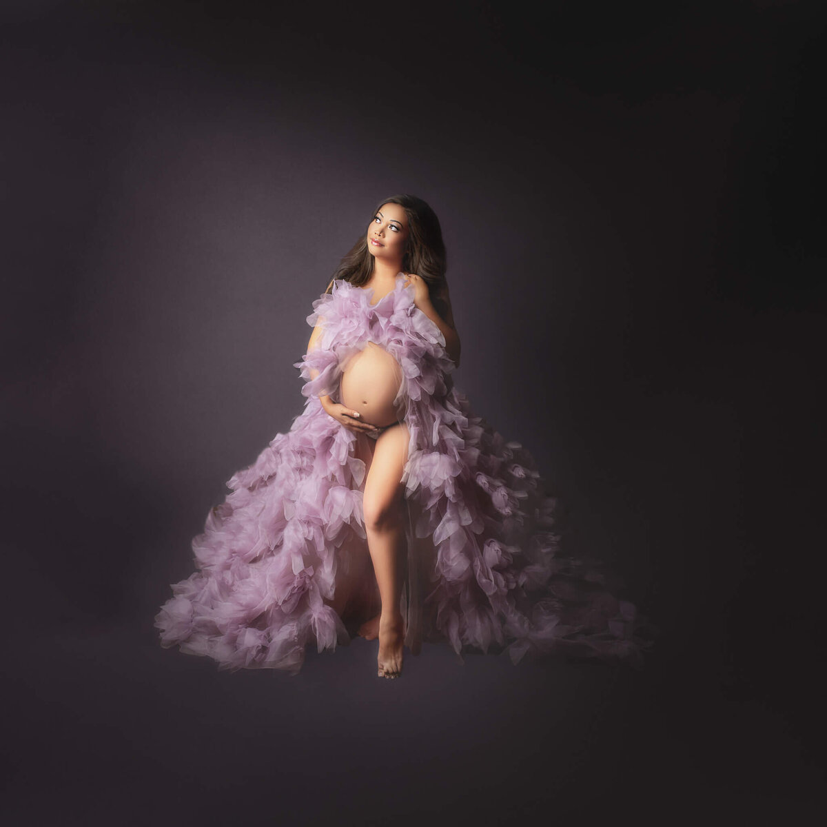 pregnant mom wearing fluffy tulle purple gown for maternity photos, Hamilton, ON