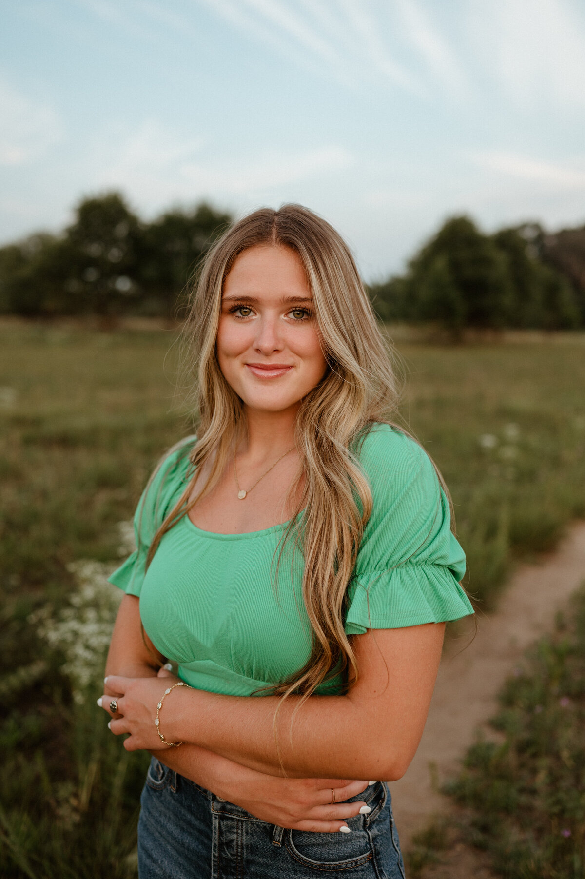 Girl with long hair in a green shirt