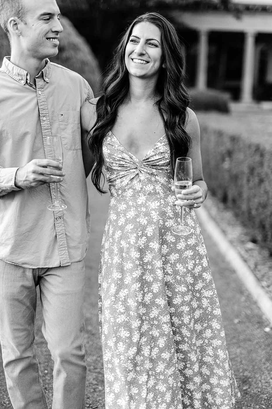 Young Connecticut Engaged Couple with champagne in Garden