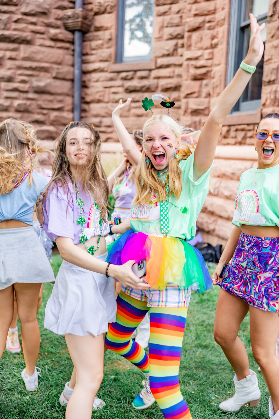 3 girls in Gamma Phi's sorority at SLU cheering