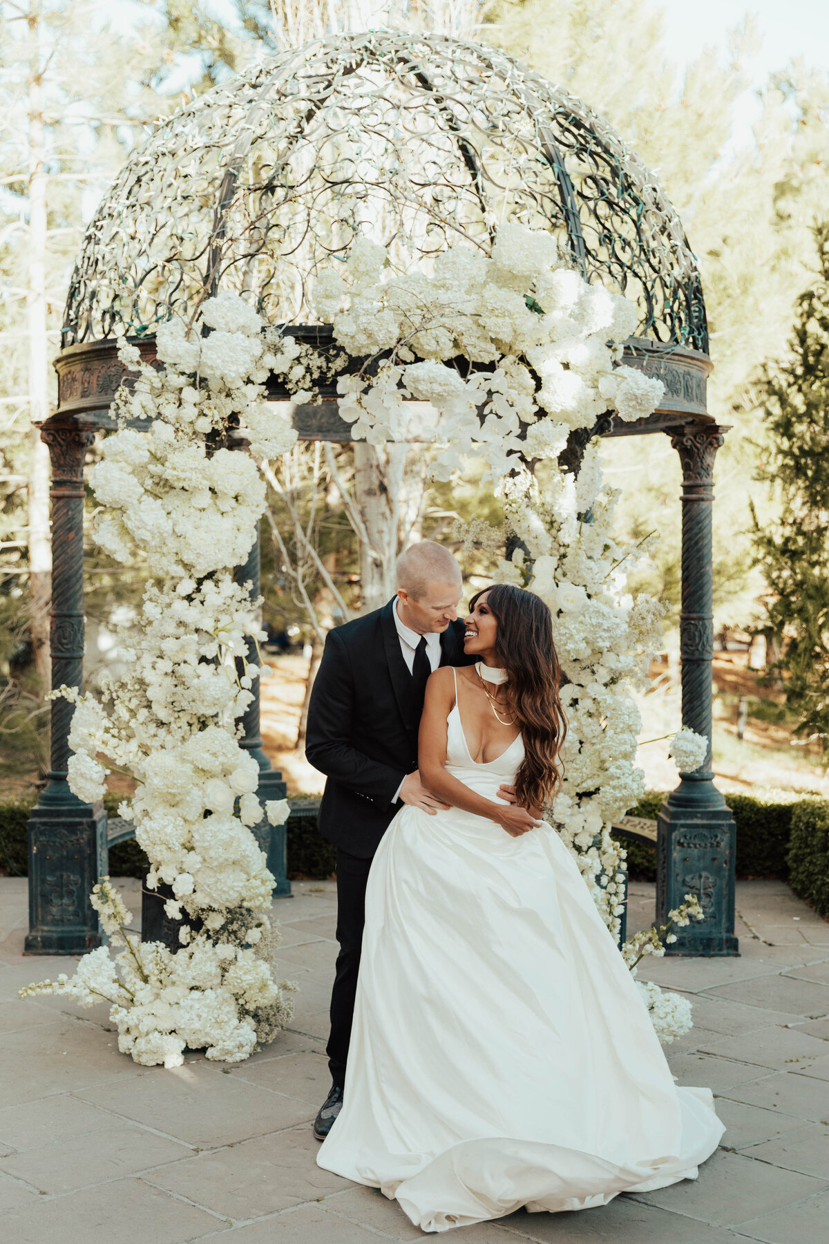 white wedding floral arch, interracial bride and groom, black bride, destination wedding photographer, nashville wedding photographer, atlanta weddign photographer, charleston wedding photographer