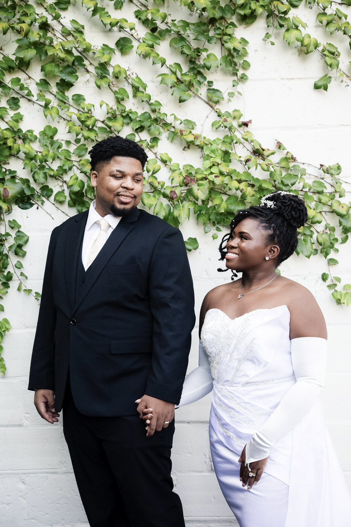 atlanta-couple-wedding-portrait-white-wall-greenery