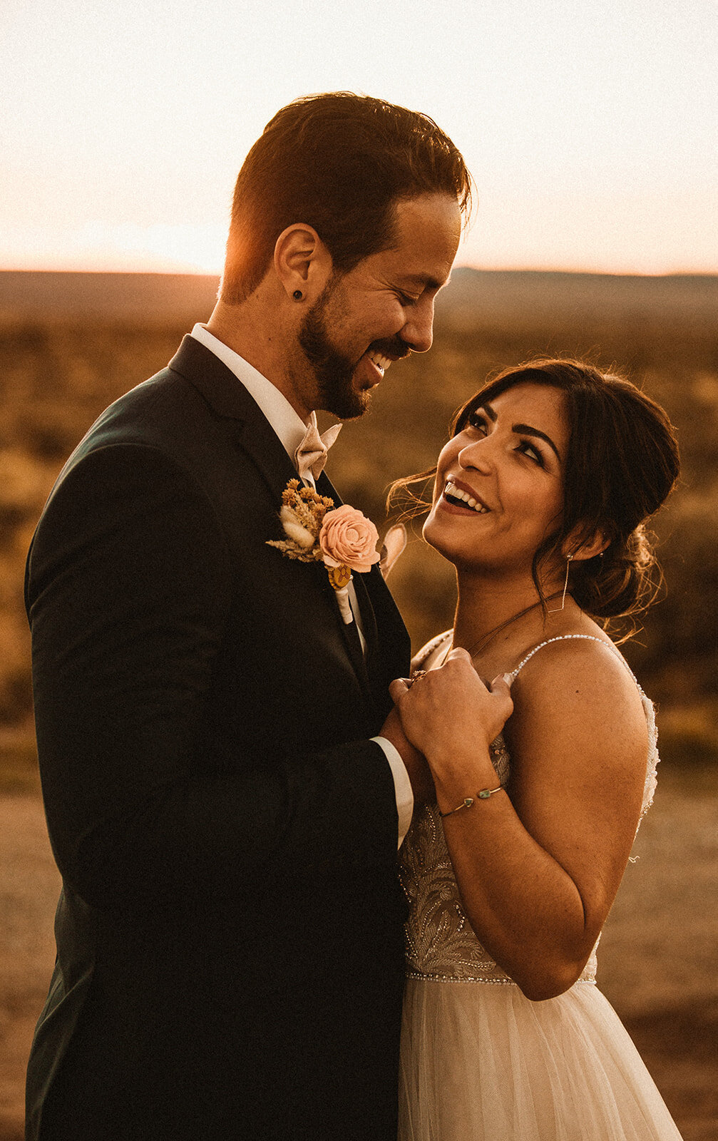 bride smiles at groom 