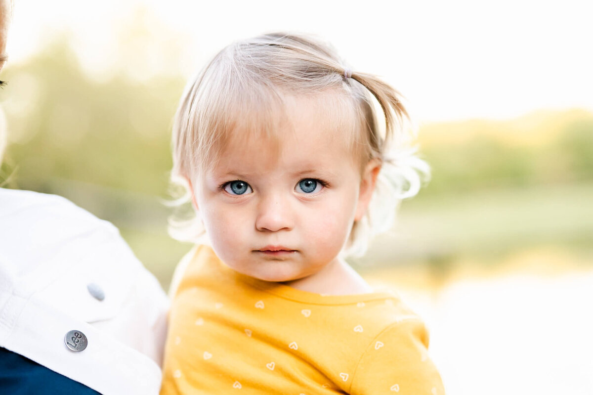 Serious toddler face at family session near Geneva, IL.