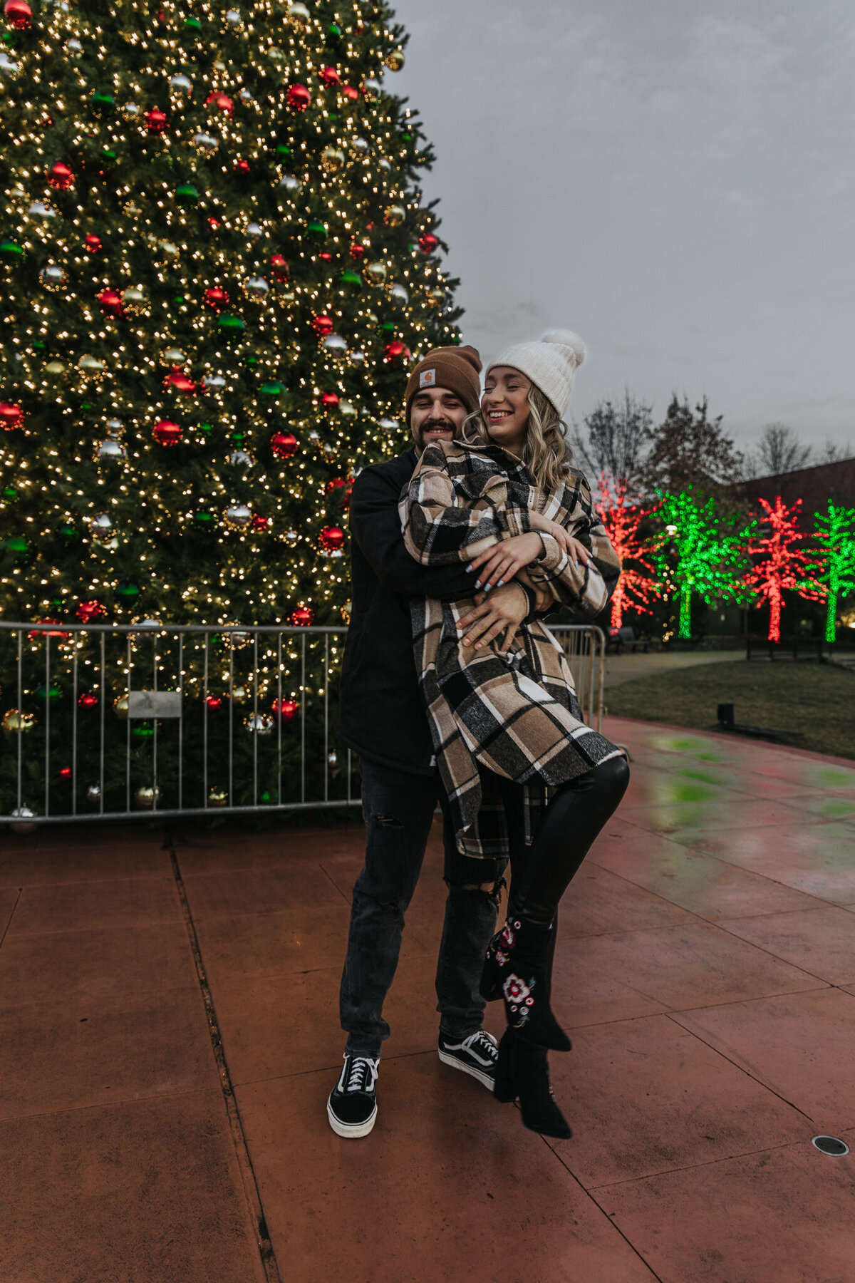 Christmas couple photoshoot with giant Christmas tree in Valparaiso, IN