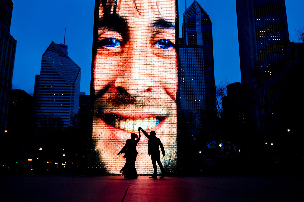 A couple dances together during a Millennium Park engagement session.