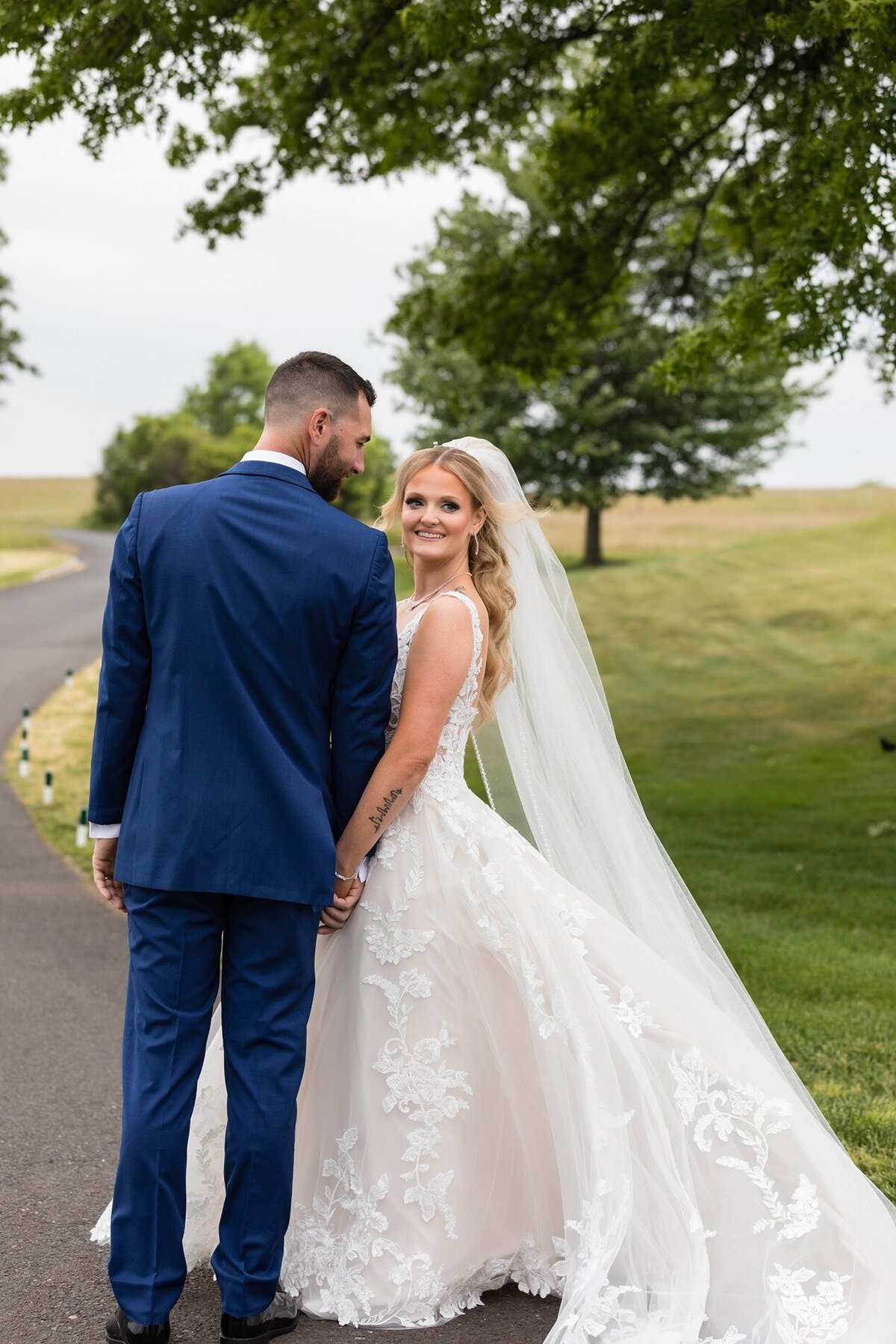 bride-holding-groom-hand-trump-national-golf-club