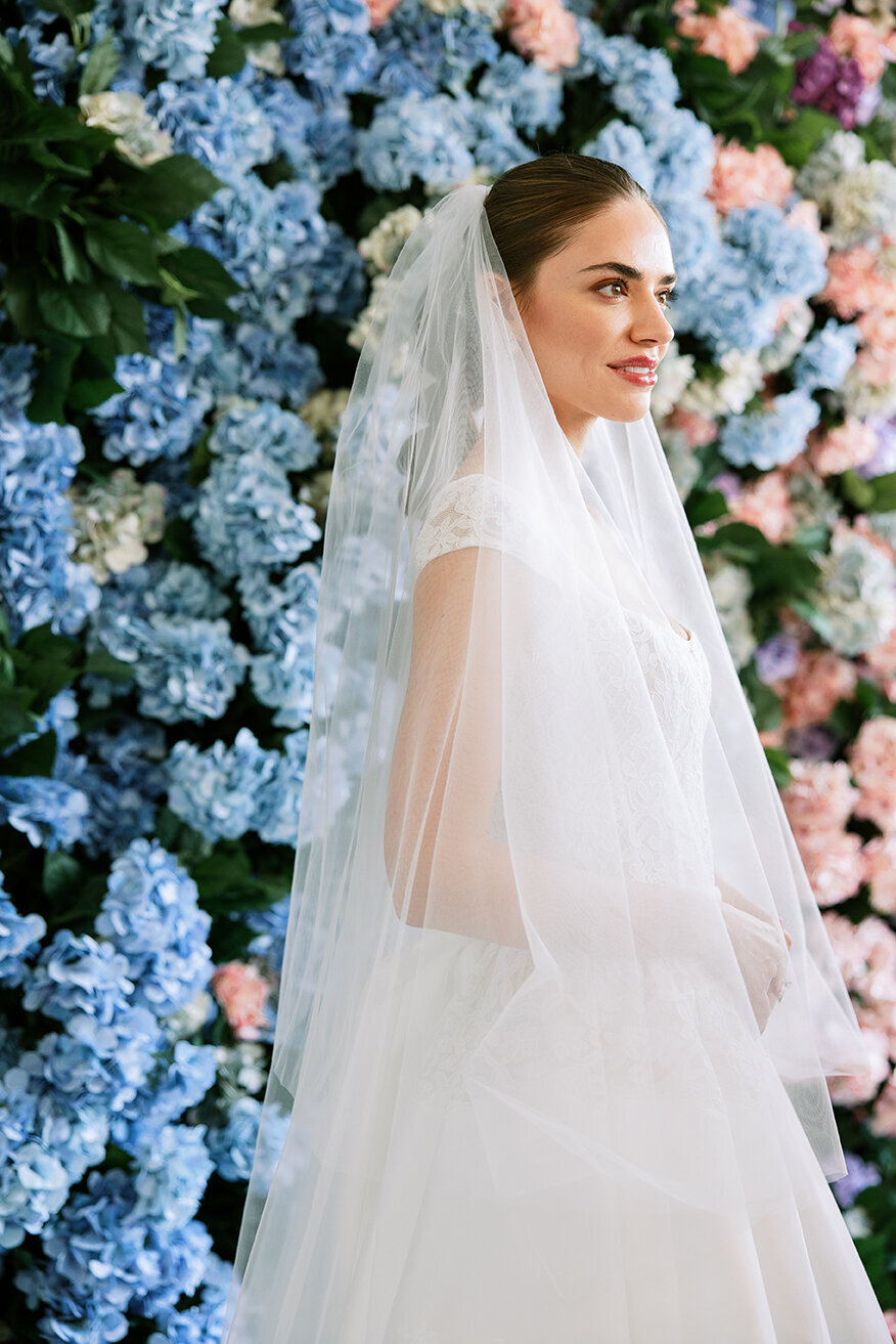 Anne Barge bride with hydrangea wall by Sarah Bradshaw