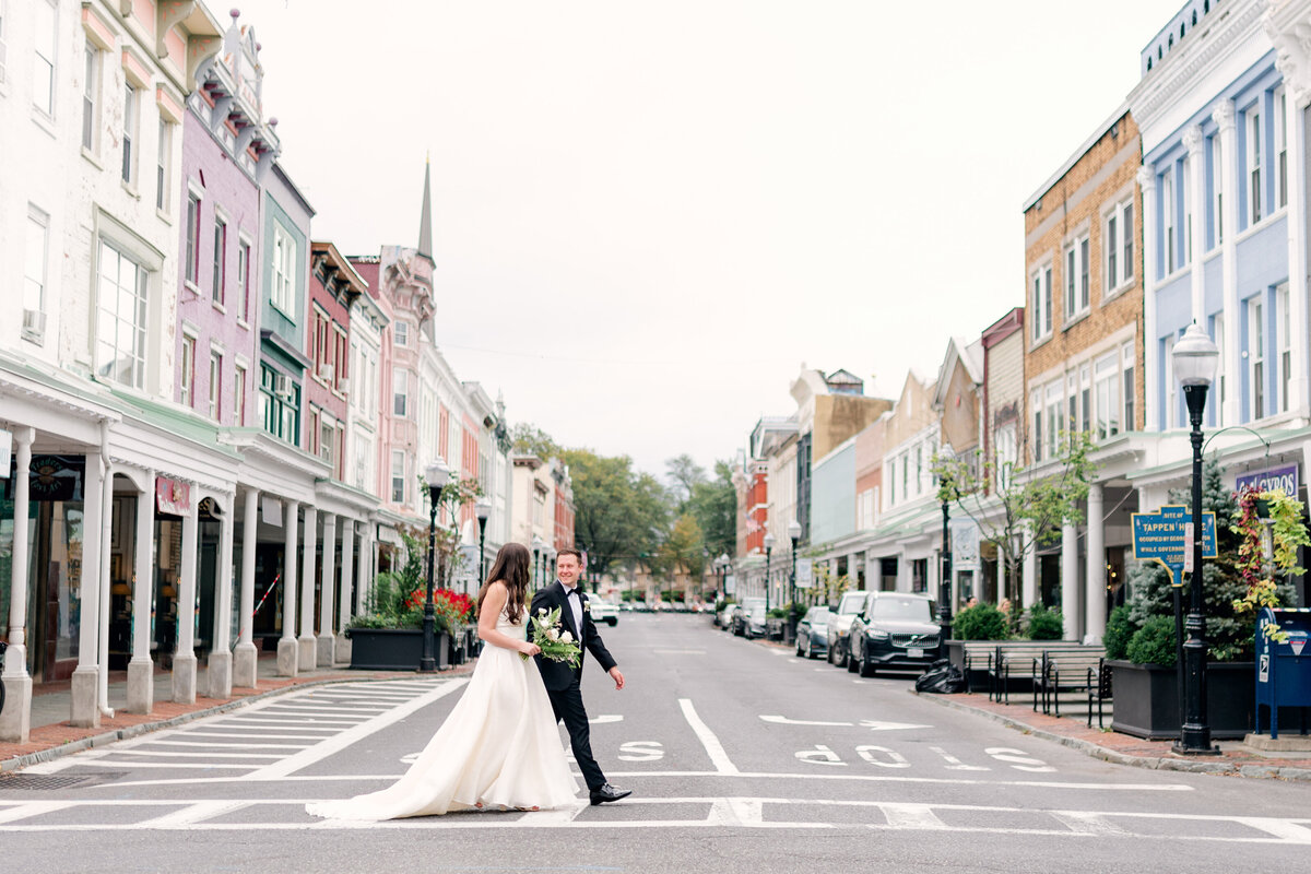 downtown wedding photography of couple crossing street