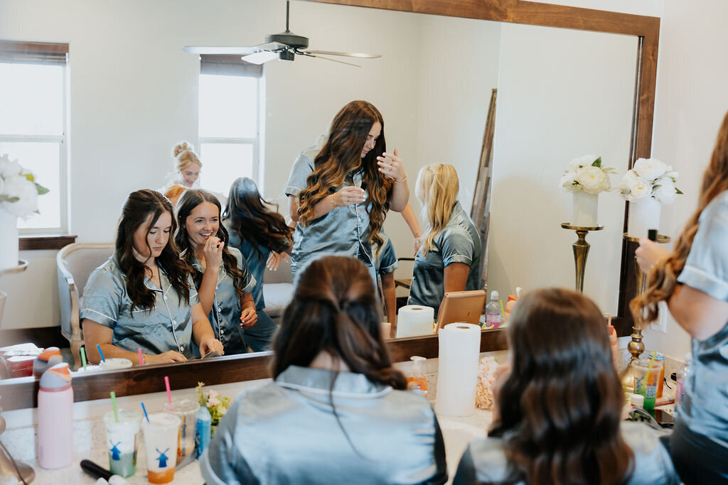 Bridesmaids getting ready in the bridal suite