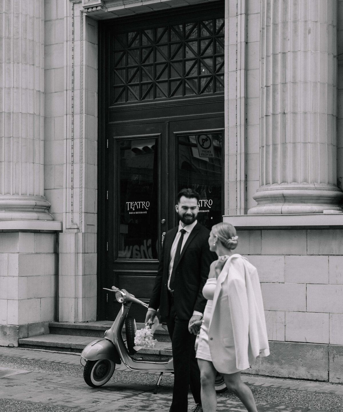 couple-walking-outside-historic-building-nika-helgeson-photography