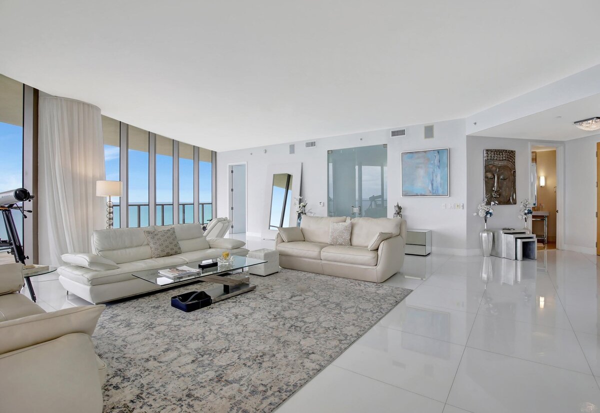  Expansive luxury living room with 10ft glass walls and direct ocean views at St. Regis PH-888