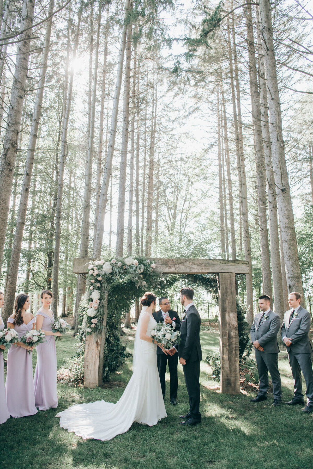 Bride and groom saying their vows in an enchanted forest