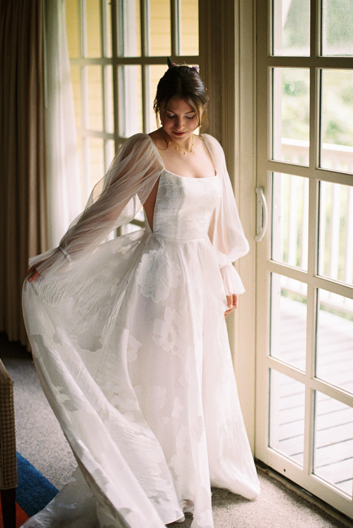 bride holding dress