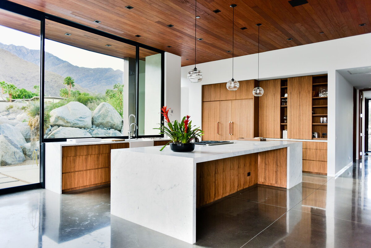 Kitchen with expansive glass views designed by Palm Springs architect
