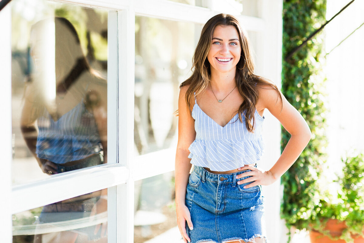 high school senior girl poses for senior photography session