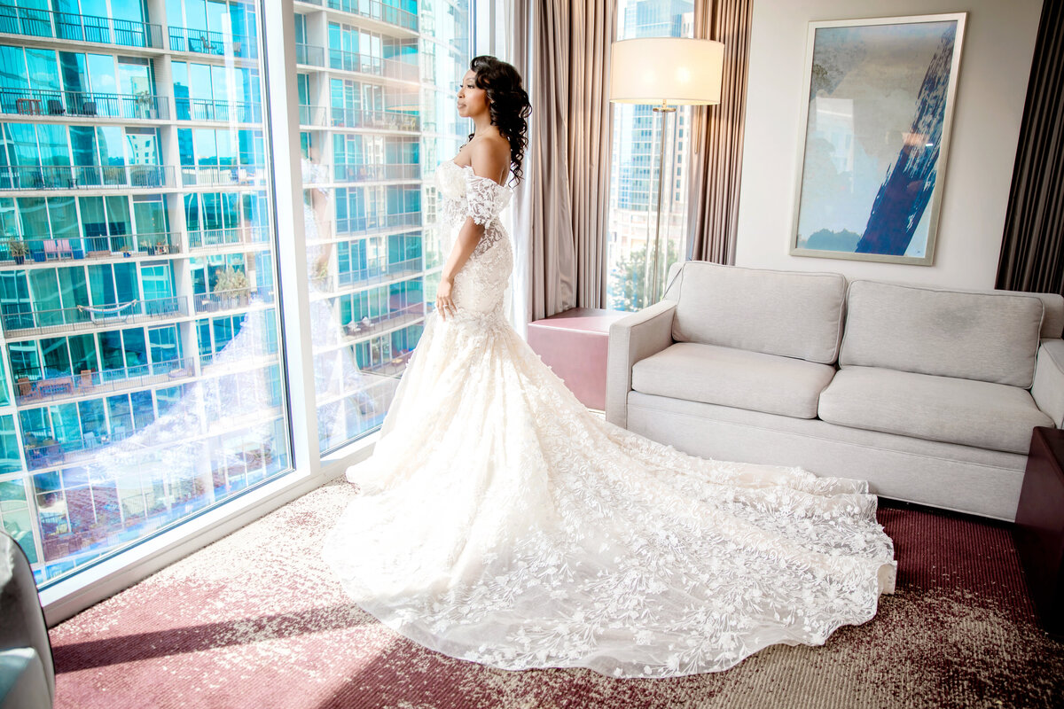 bride-looking-out-of the-window-at-lowes-atlanta-wedding-ninjas-photography