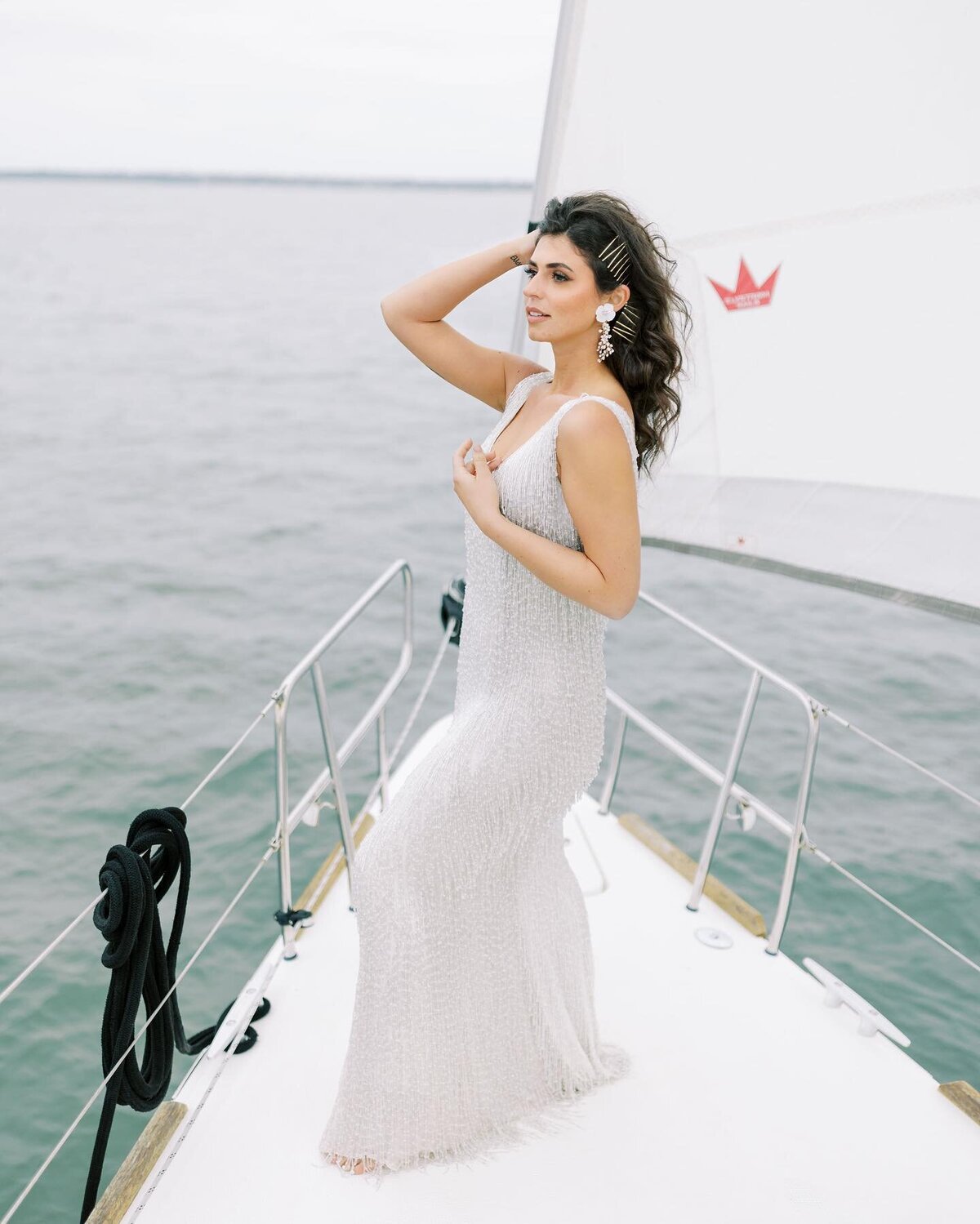 Girl in hair style on sail boat