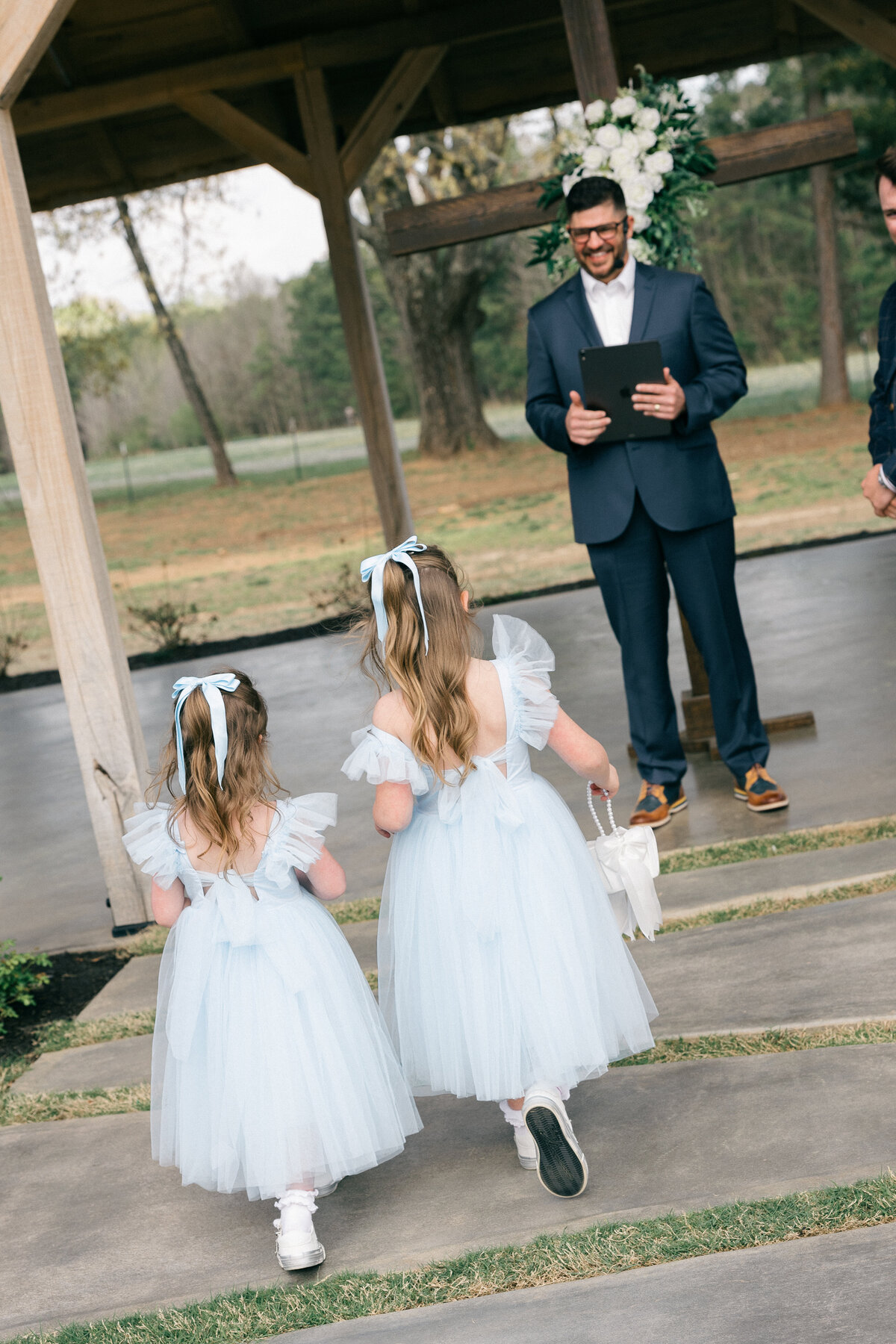 Flower Girls in Powder-Blue Tulle Walking the Aisle – Northwest Arkansas Wedding Photographer