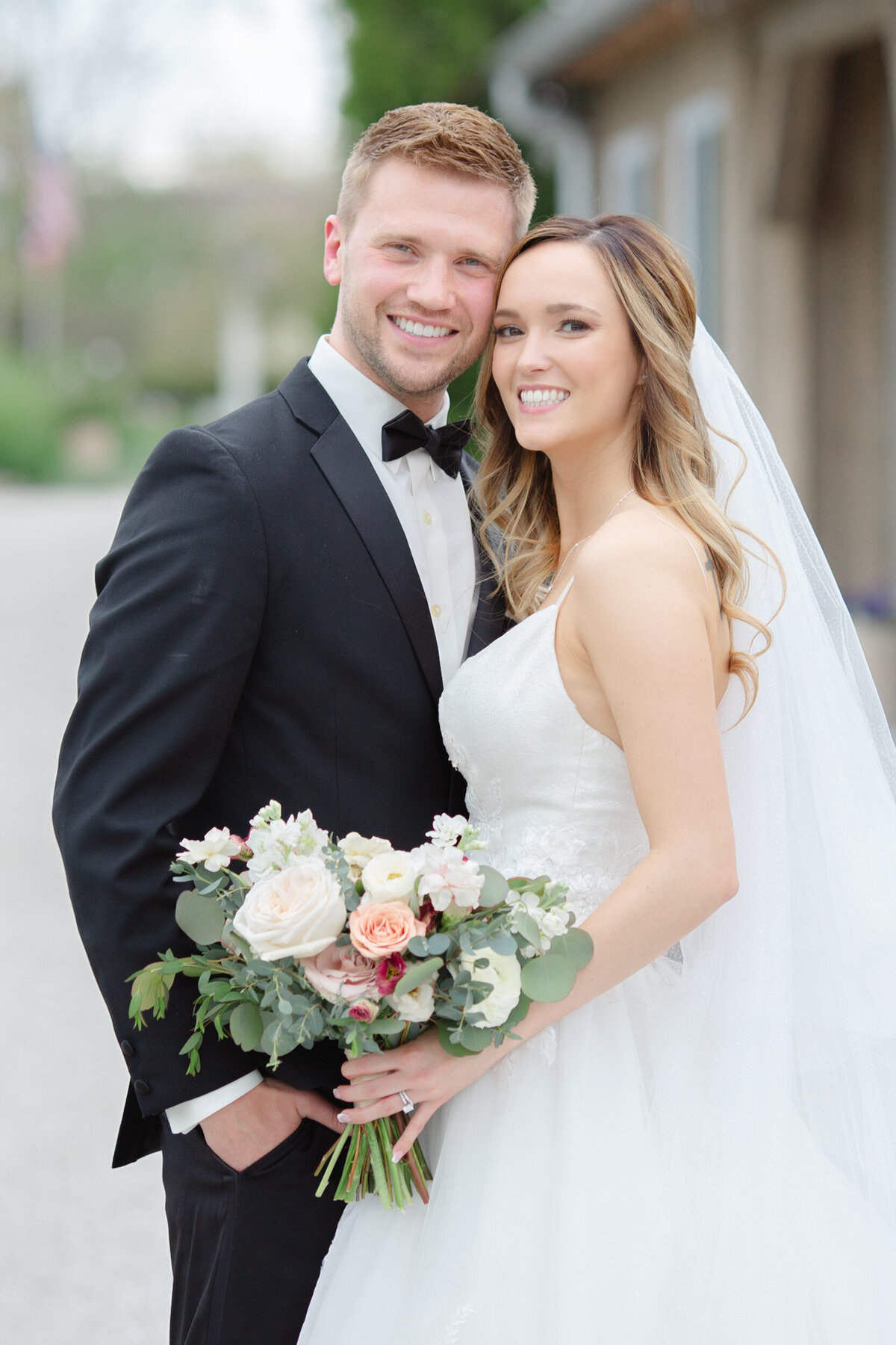 bride and groom on their wedding day at jorgensen farms oak grove