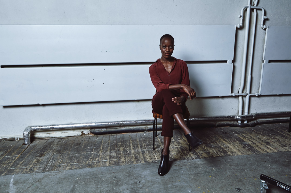 A close-up portrait with dramatic lighting, suitable for promo material.