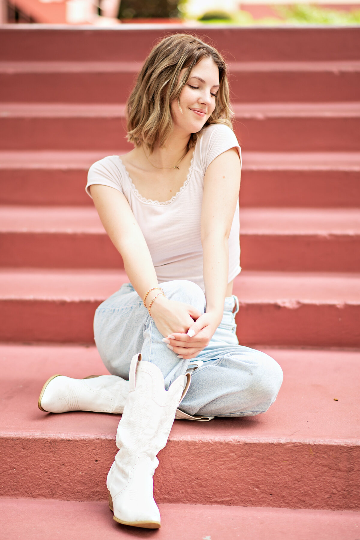 Senior Girl Stting on pink steps in Orlando